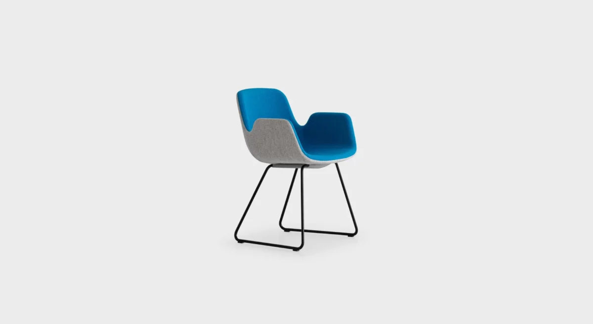 PASS S130 lounge chair by Lapalma, designed by Hee Welling, featuring a fluid, wave-inspired profile with a sled base in matte chrome or powder-coated steel, upholstered in fire-retardant molded foam and available in fabric, eco-leather, or leather finishes.