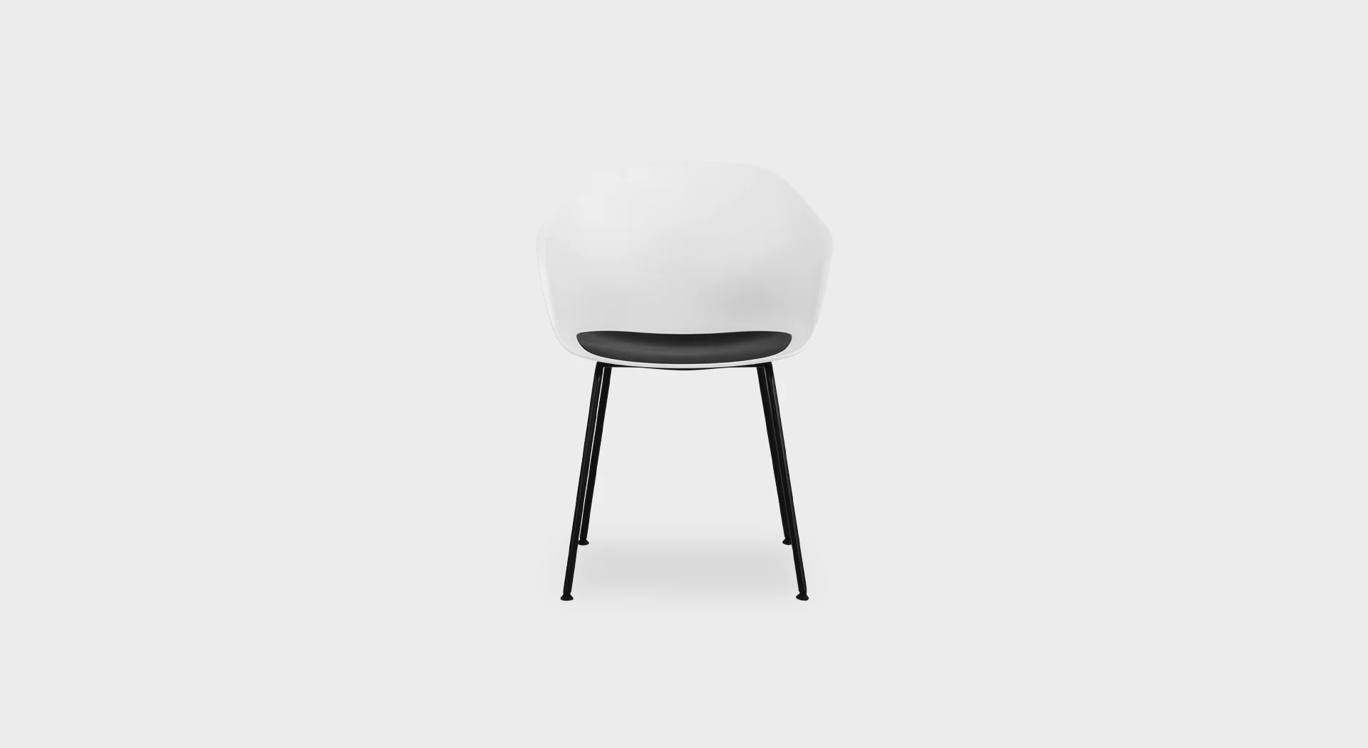 Seela S312 dining chair by Lapalma, featuring a polypropylene shell with a seamless seat pad in wood, fabric, or polypropylene, and a four-legged base in matte chrome or powder-coated steel.
