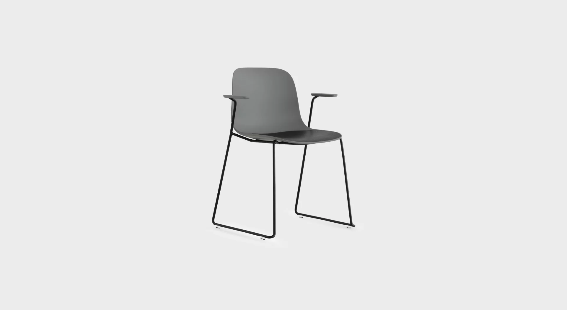 Modern stackable chair with a minimalist design, featuring a curved polypropylene shell and sleek sled base for comfort and versatility.