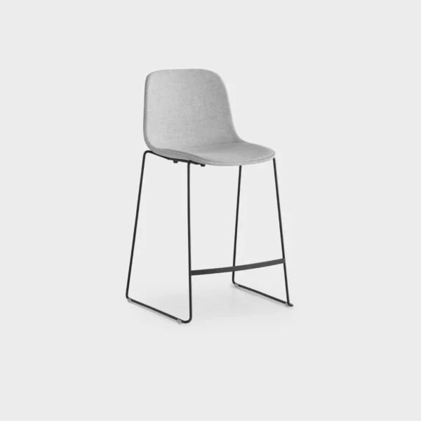Lapalma Seela S320 H65 counter stool with polypropylene shell, upholstered seat pad, and black powder-coated sled base, designed by Antti Kotilainen.