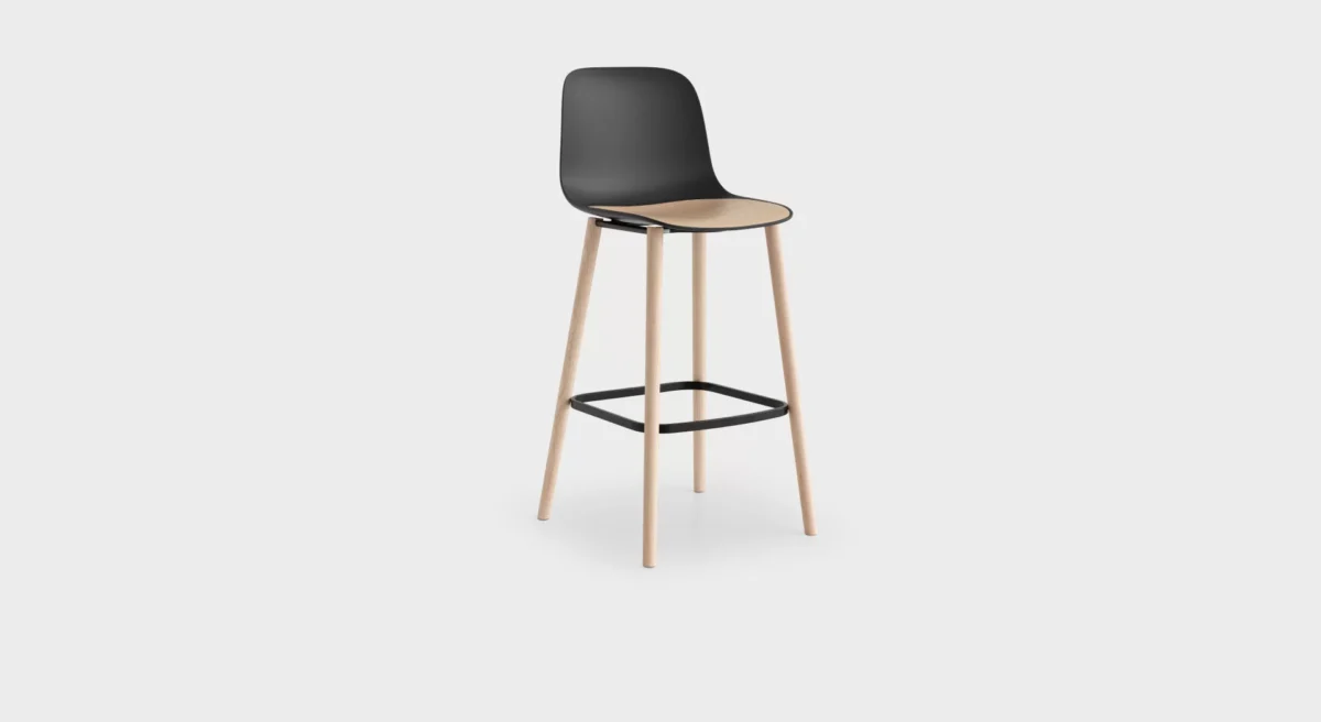 Modern bar stool with slim metal frame and round seat by Lapalma.