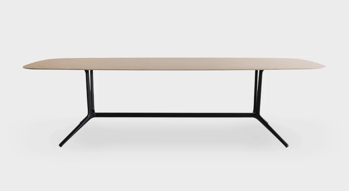 Compact round side table with slim pedestal base by Lapalma.