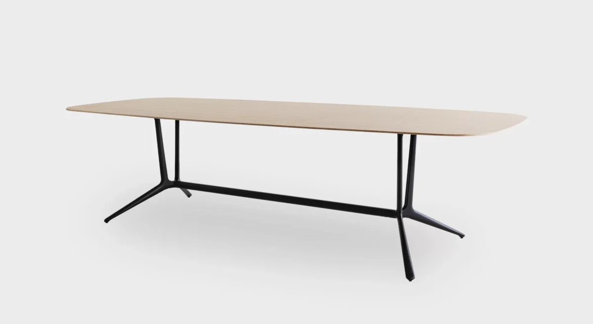 Compact round side table with slim pedestal base by Lapalma.