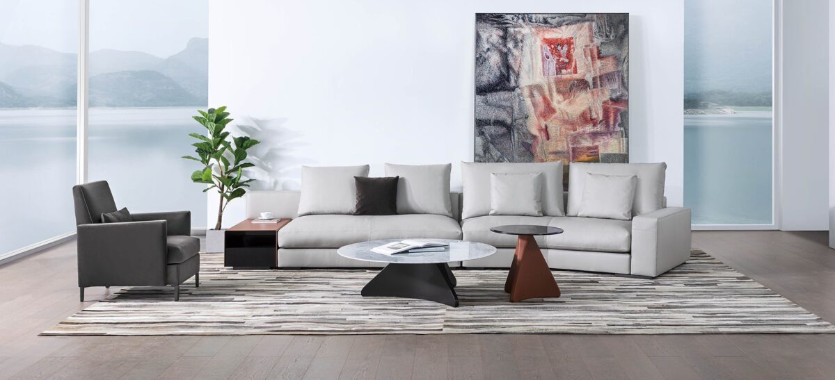 Cozi armchair by Camerich in dark charcoal leather with high back and black steel legs
