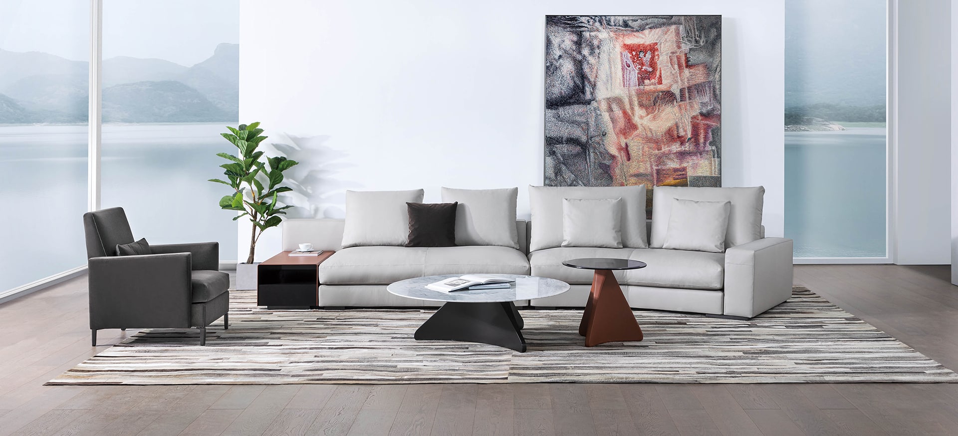 Cozi armchair by Camerich in dark charcoal leather with high back and black steel legs