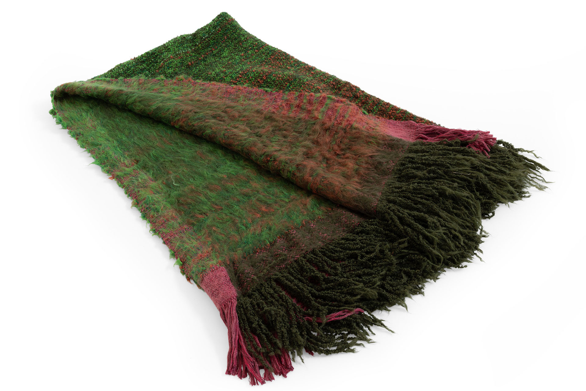 7Plaids Throw by Moroso in hand‑loomed Italian plaid design, draped over a sofa in a Royal Oak Michigan showroom