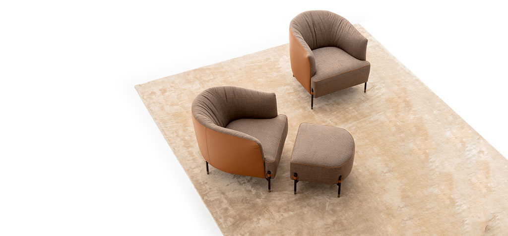 Diga armchair by Nicoline Italia with enveloping lines and external legs, perfect for modern interiors in Royal Oak, Michigan.