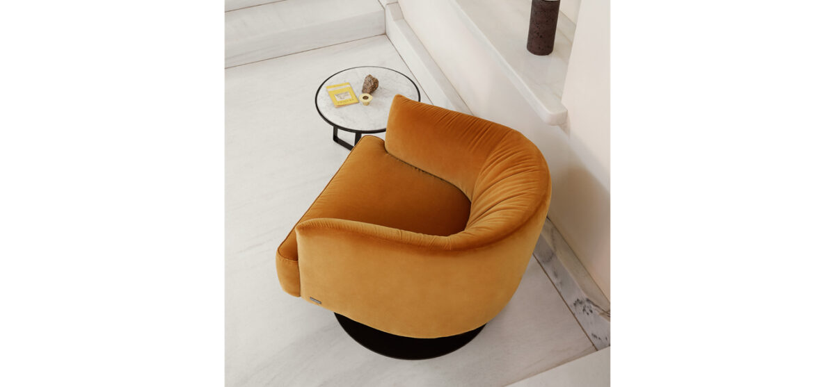 Diga Swivel lounge chair by Nicoline Italia featuring plush cushioning and a sleek circular base, perfect for contemporary spaces in Birmingham, Michigan.