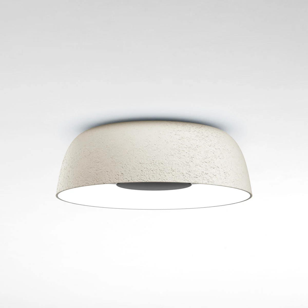 “Modern wall or ceiling lamp Djembé by Marset – sculptural form with stone-like exterior finish”