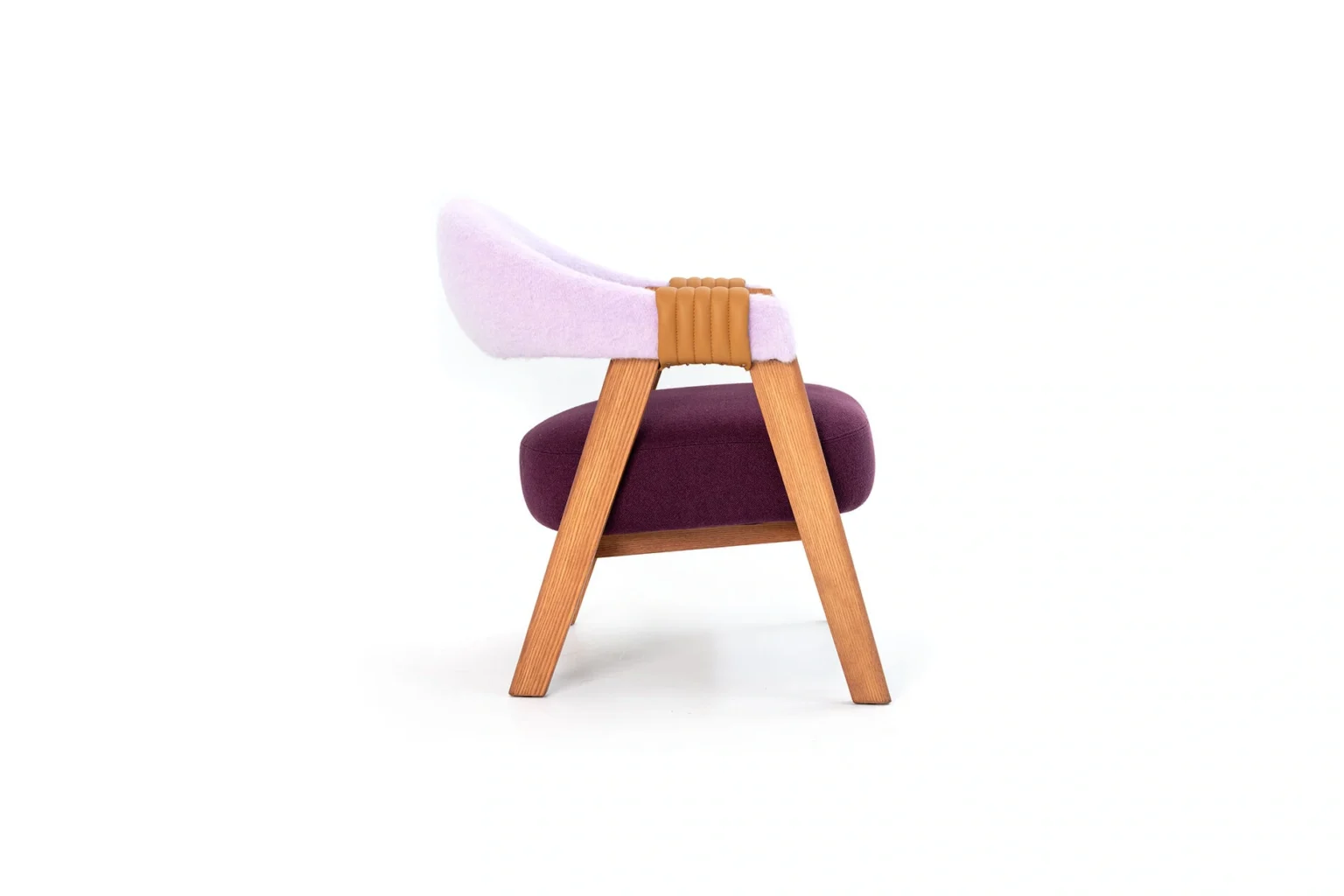 Mathilda by Moroso showcasing elegant curved backrest and slim metal legs at the Michigan Design Center