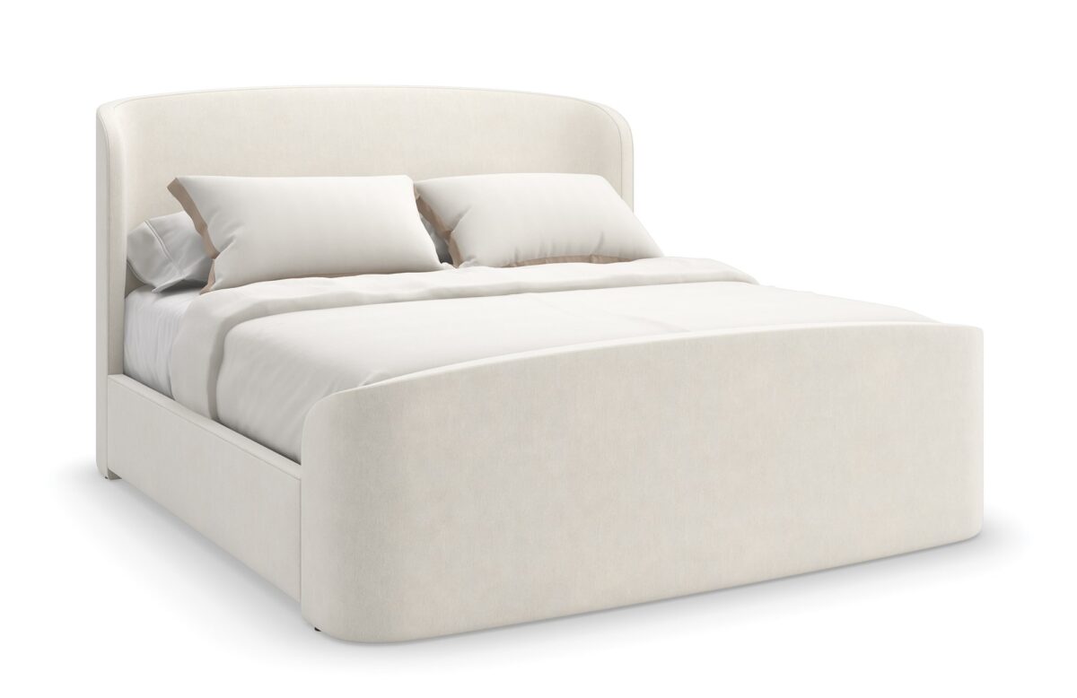 Caracole SOFT EMBRACE King Bed, featuring a tall, deeply tufted headboard that gently curves inward, creating a cocoon-like and inviting feel.