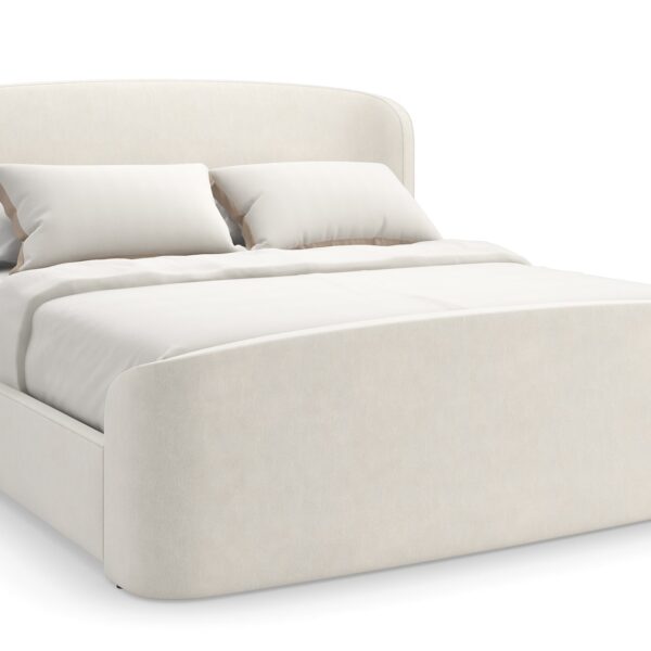Caracole SOFT EMBRACE King Bed, featuring a tall, deeply tufted headboard that gently curves inward, creating a cocoon-like and inviting feel.