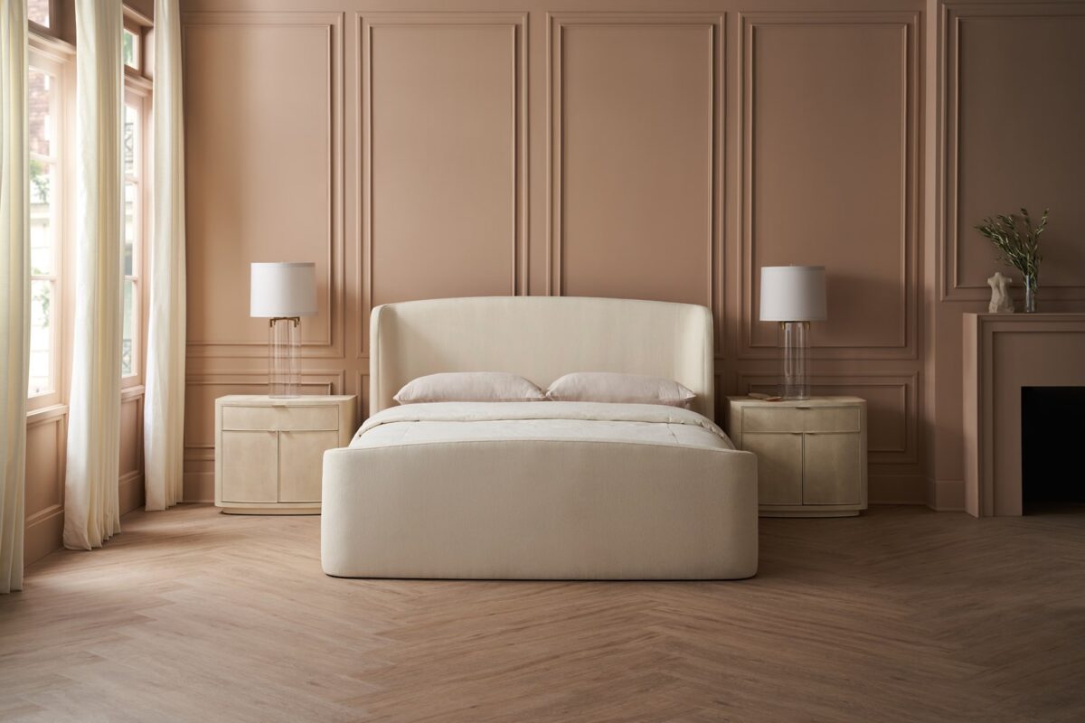 Caracole SOFT EMBRACE King Bed, featuring a tall, deeply tufted headboard that gently curves inward, creating a cocoon-like and inviting feel.
