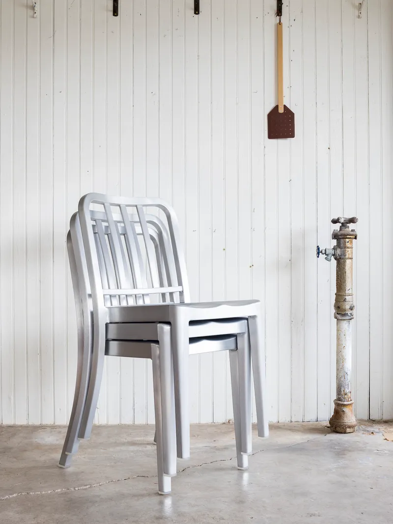 Emeco Heritage Rocking Chair, featuring elegant curves and a sturdy frame for relaxed seating.