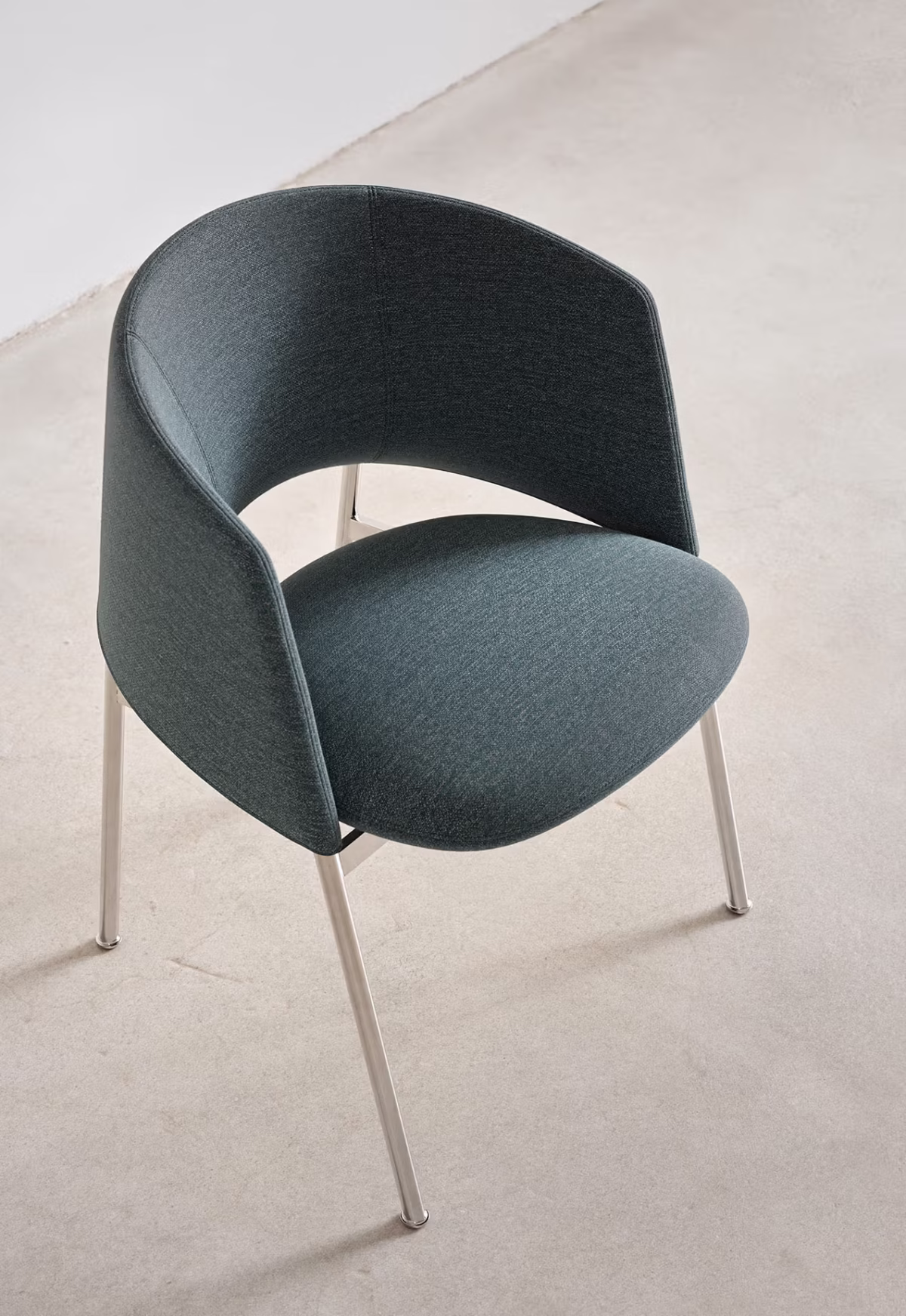 Detailed view of the Collar Dining Chair's fabric upholstery, demonstrating its texture and quality finish.