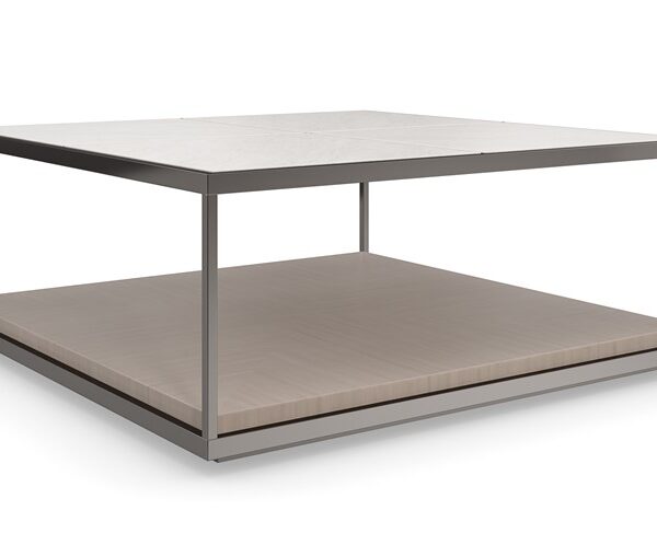 Cartesian by Caracole — a geometric-inspired cocktail table with a glass top and intersecting metal base.