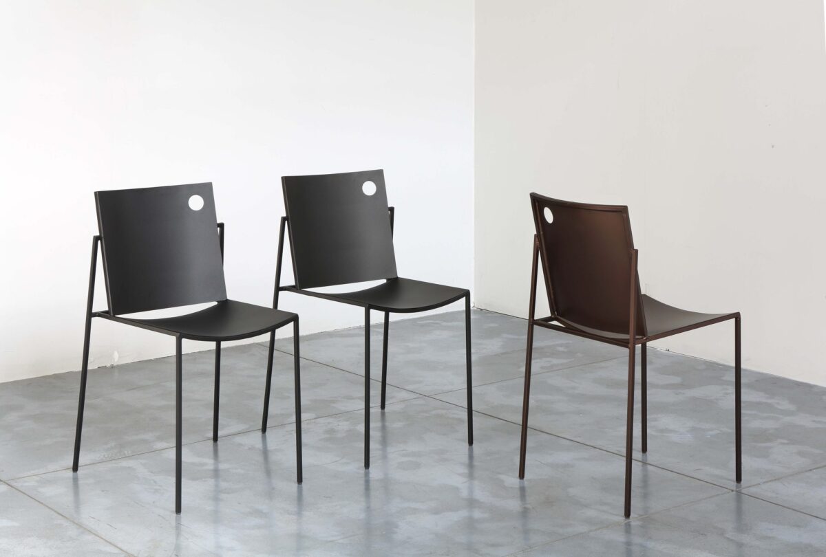Side view of AURORA Chair showcasing its minimalist design and stackable structure, perfect for modern indoor or outdoor spaces.