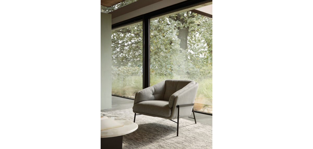 Fashion armchair by Nicoline Italia with elegant lines and metal frame, perfect for modern interiors in Royal Oak, Michigan.