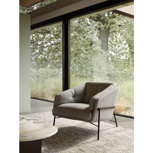 Fashion armchair by Nicoline Italia with elegant lines and metal frame, perfect for modern interiors in Royal Oak, Michigan.