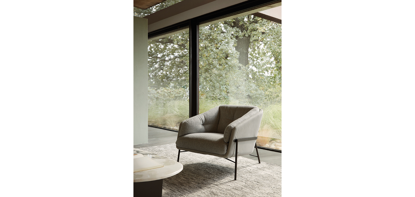 Fashion armchair by Nicoline Italia with elegant lines and metal frame, perfect for modern interiors in Royal Oak, Michigan.