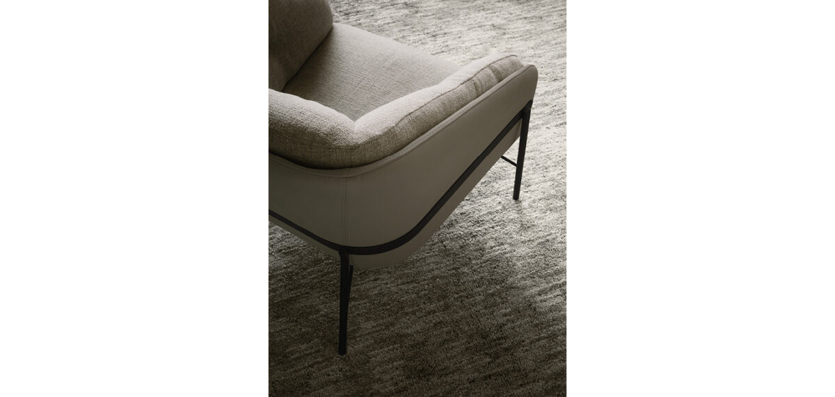 Fashion armchair by Nicoline Italia with elegant lines and metal frame, perfect for modern interiors in Royal Oak, Michigan.