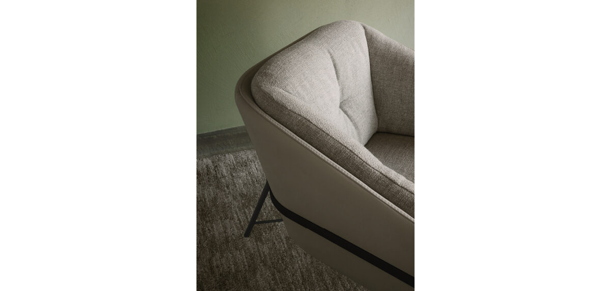 Fashion armchair by Nicoline Italia with elegant lines and metal frame, perfect for modern interiors in Royal Oak, Michigan.