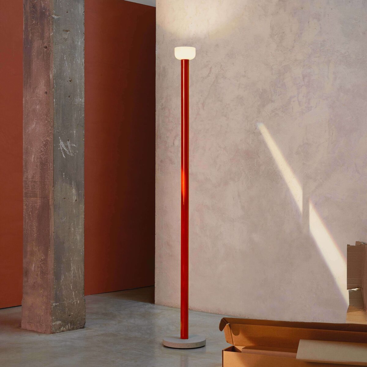 Edward Barber & Jay Osgerby’s Bellhop Floor lamp casting indirect uplight through an upside‑down glass shade