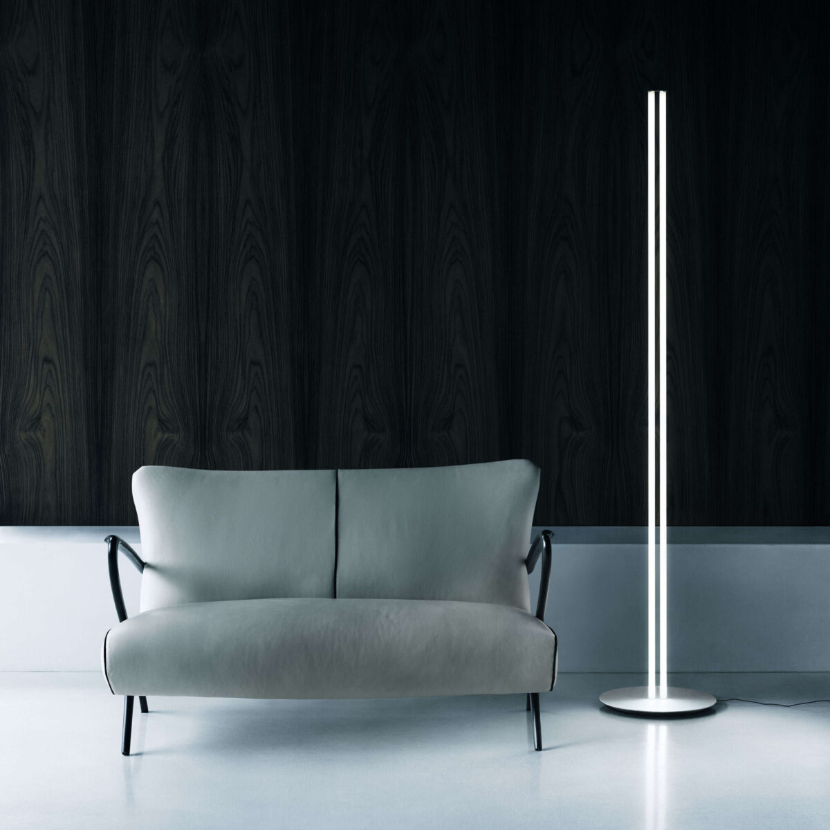 White Superloon lamp featuring silk-screened PMMA disc glowing with adjustable warm-to-cool tones in modern living room" – describes finish, material & ambiance.