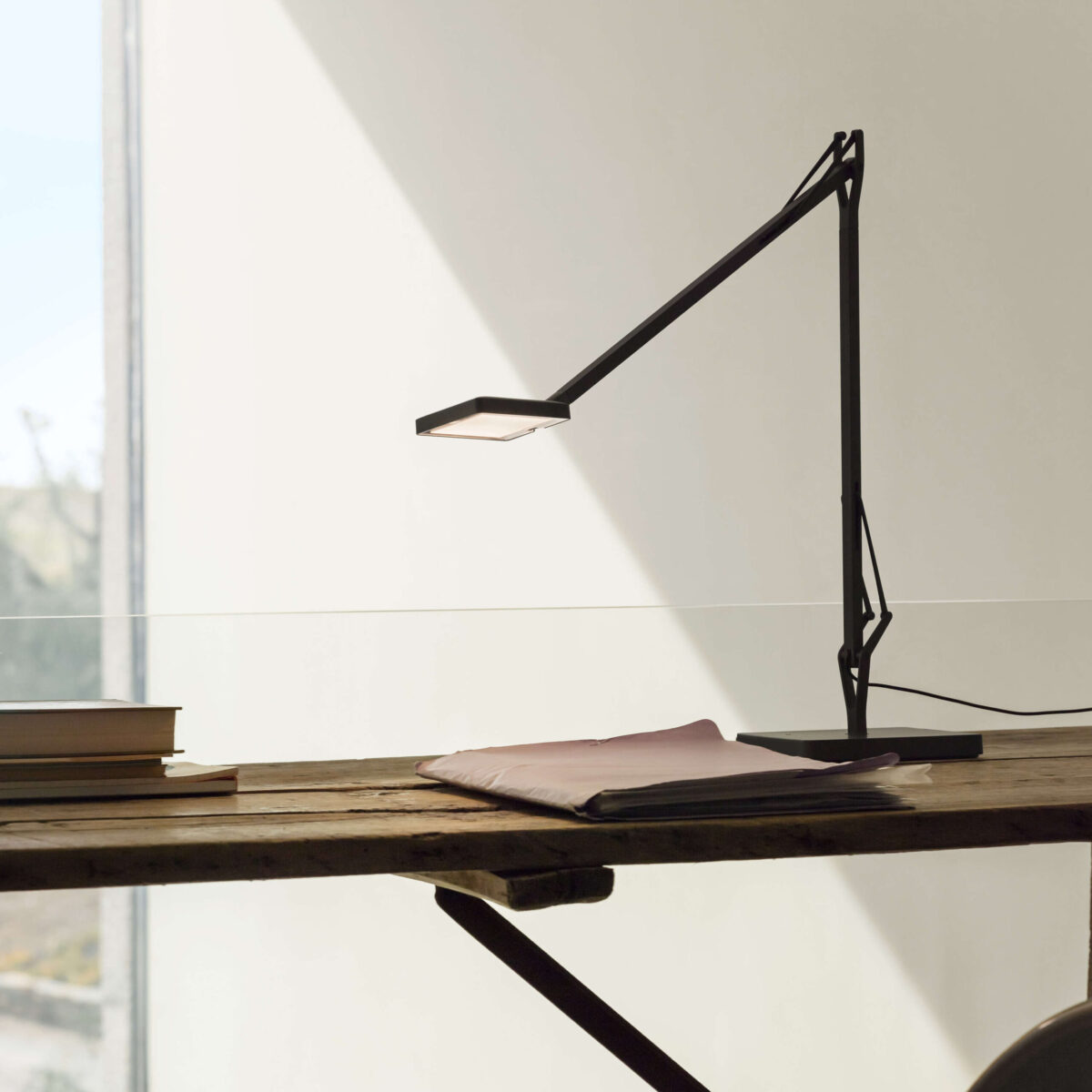 Kelvin Edge Base by Flos showcasing adjustable pivot joint and Soft‑Touch dimmer on head at the Michigan Design Center