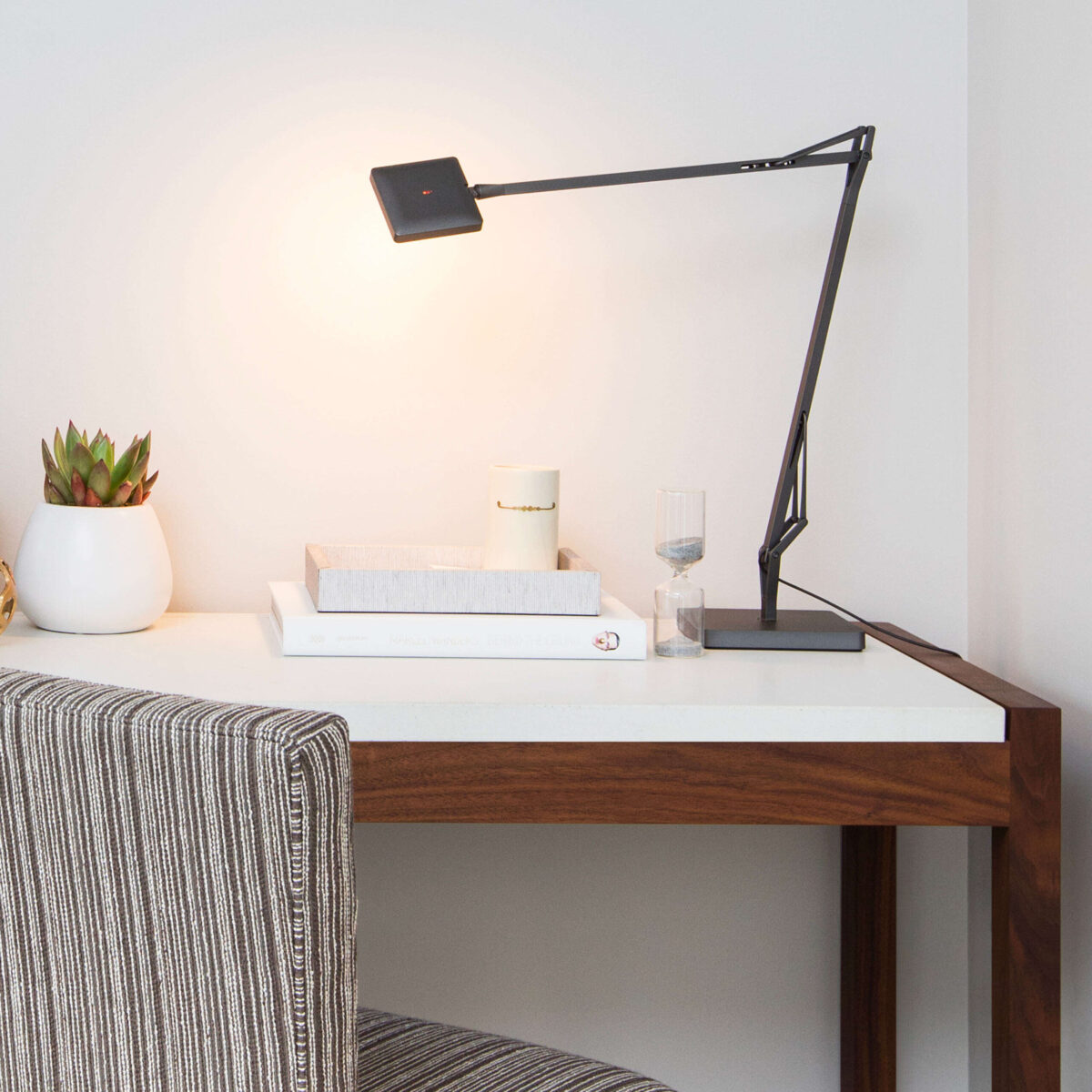 Kelvin LED Base by Flos showcasing matte-black aluminum arm and Soft Touch dimmer on the head at the Michigan Design Center