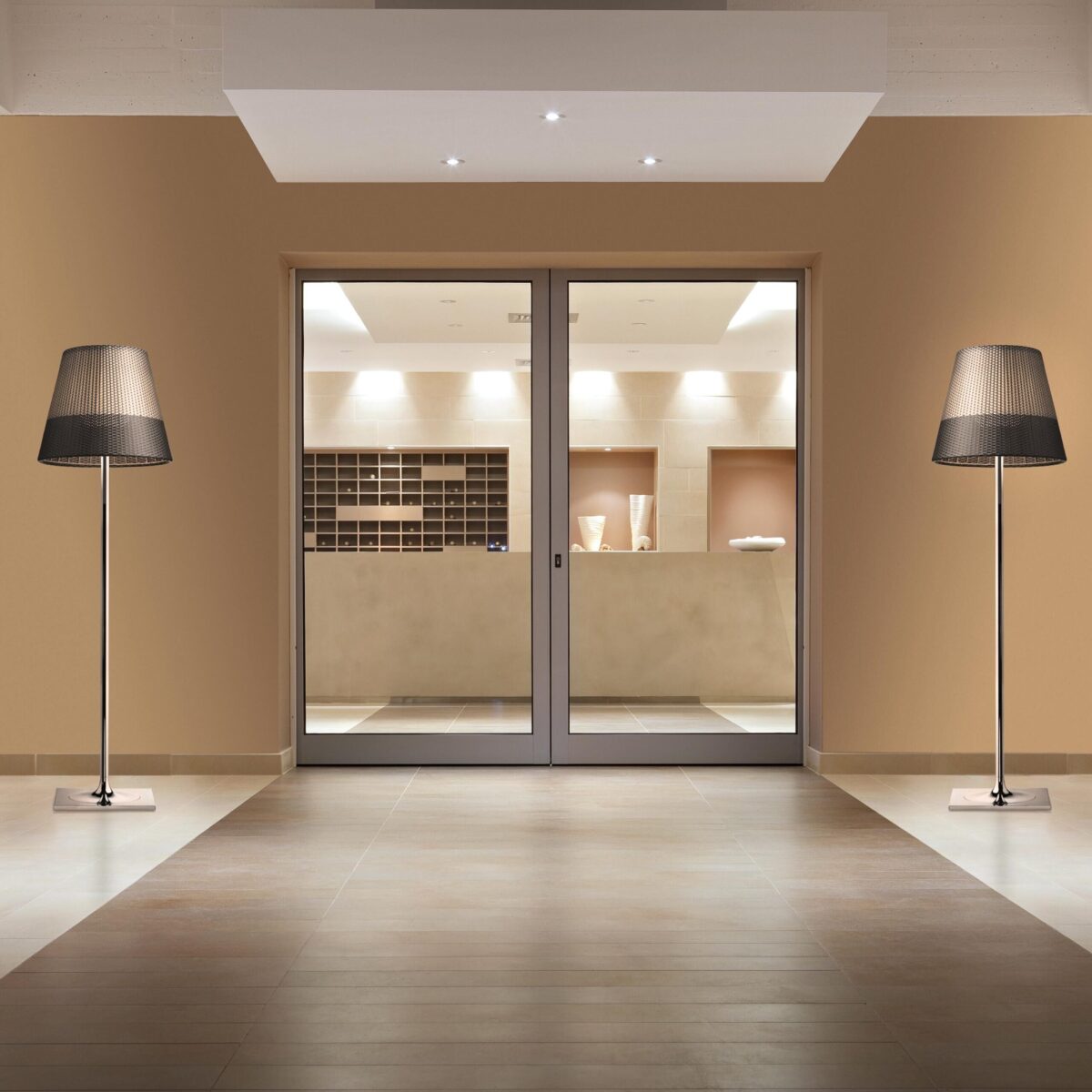 Outdoor lighting piece with oversized shade and minimalist base, KTribe F3 by Flos designed for open-air elegance.