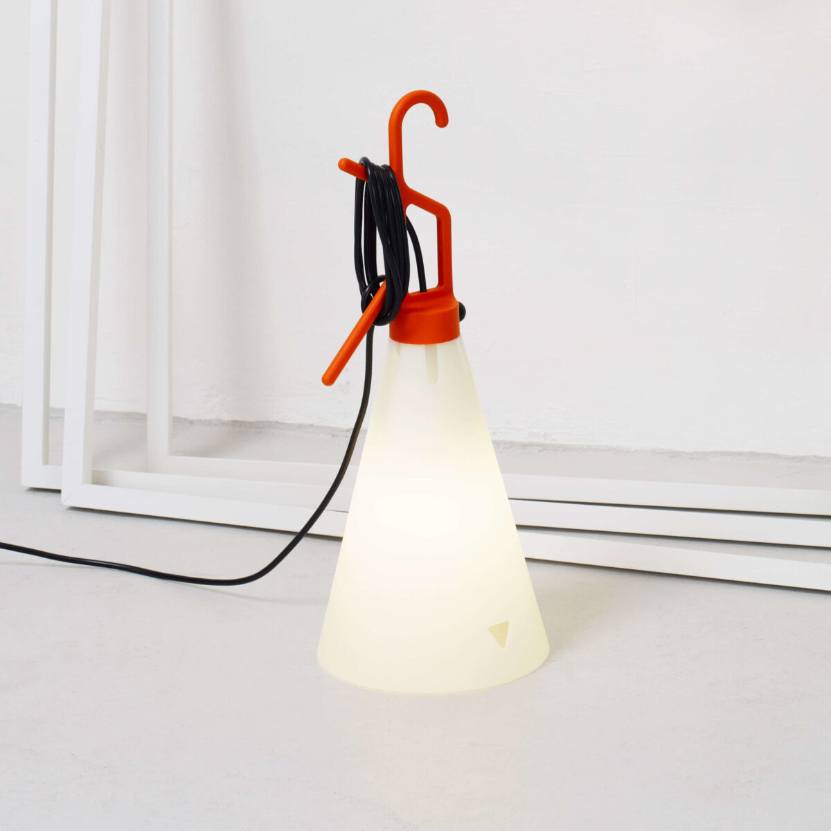 Mayday Lamp by Flos showcasing tapered conical diffuser and integrated push-button switch on handle at the Michigan Design Center