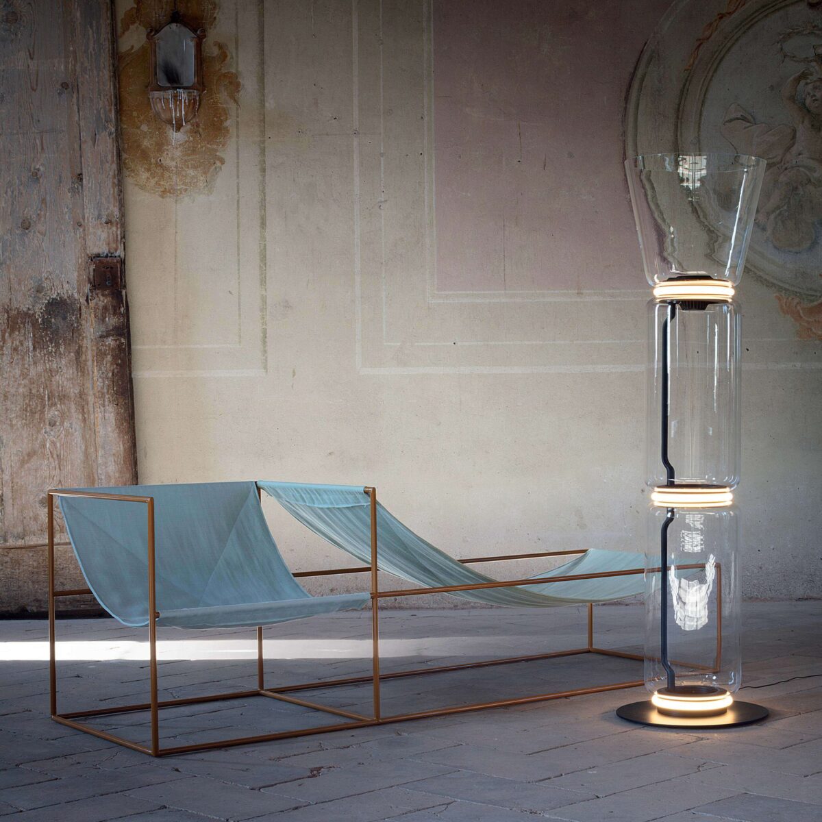 "Minimalist Konstantin Grcic design Noctambule floor lamp with dimmable LED rings at junctions of two glass modules"