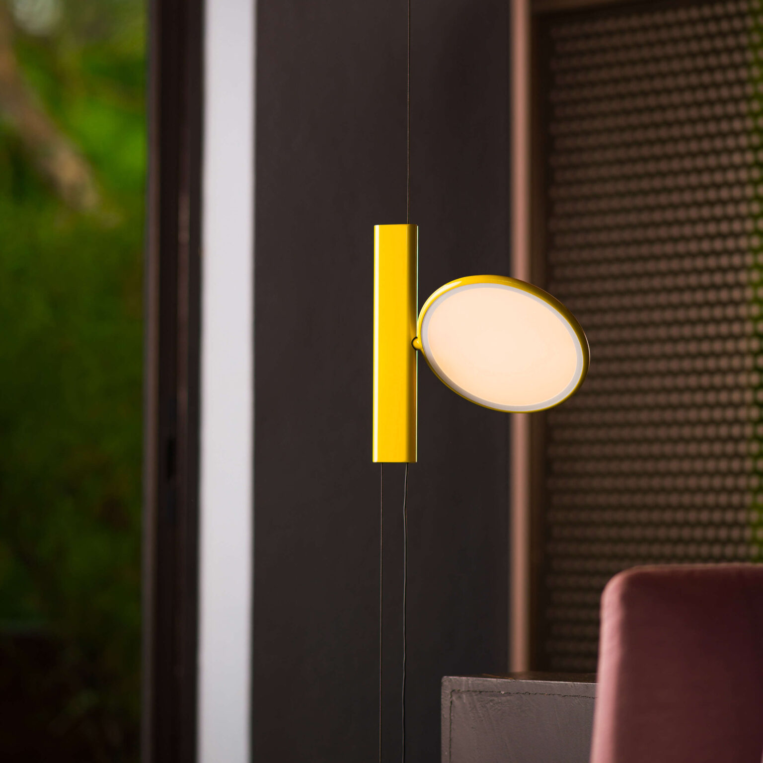 White OK pendant lamp by Flos, showcasing a minimalist design with a gloss-finished aluminum LED head and a soft-touch dimmer switch.