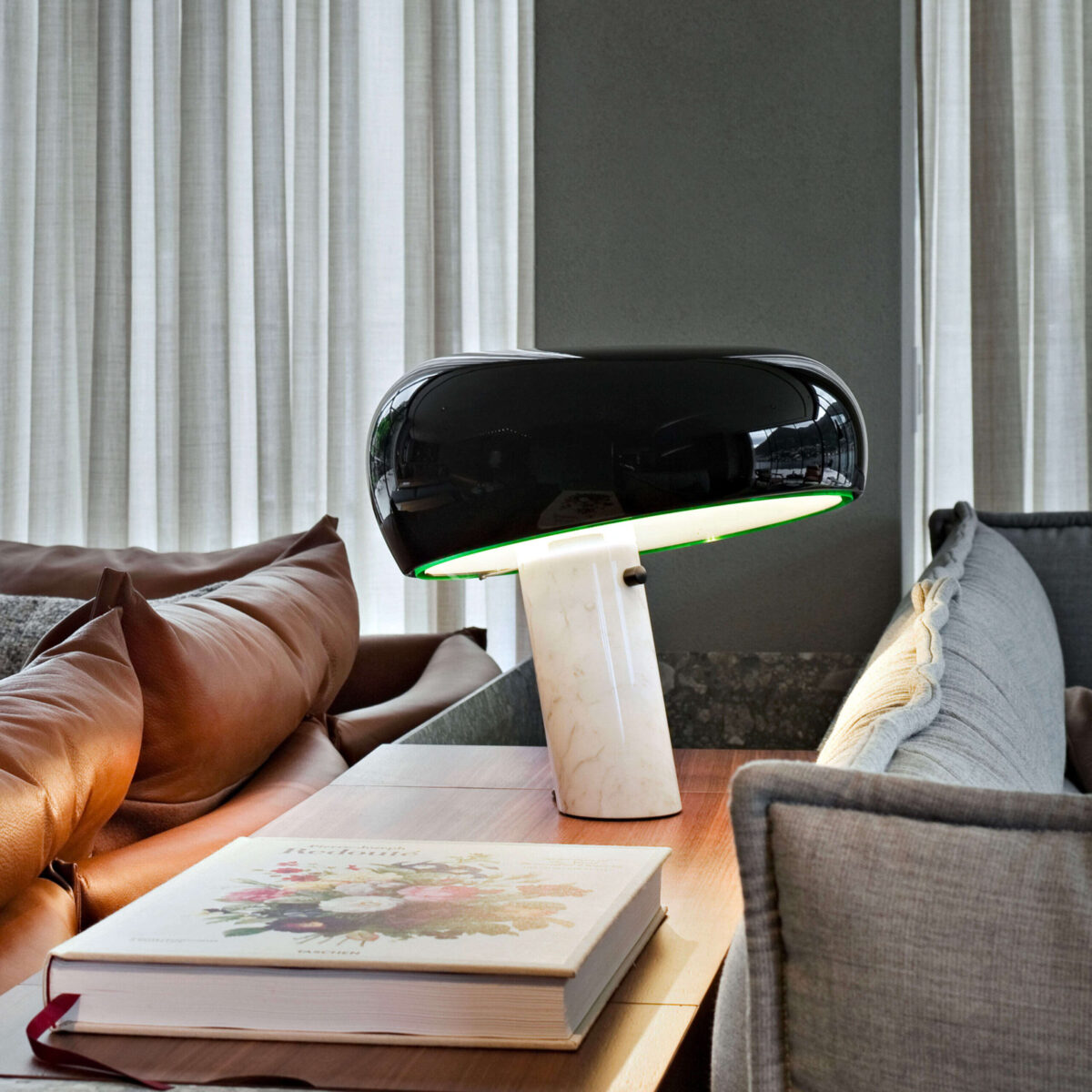Snoopy Table Lamp by Flos showcasing iconic slanted marble base and reflector in a Michigan Design Center display
