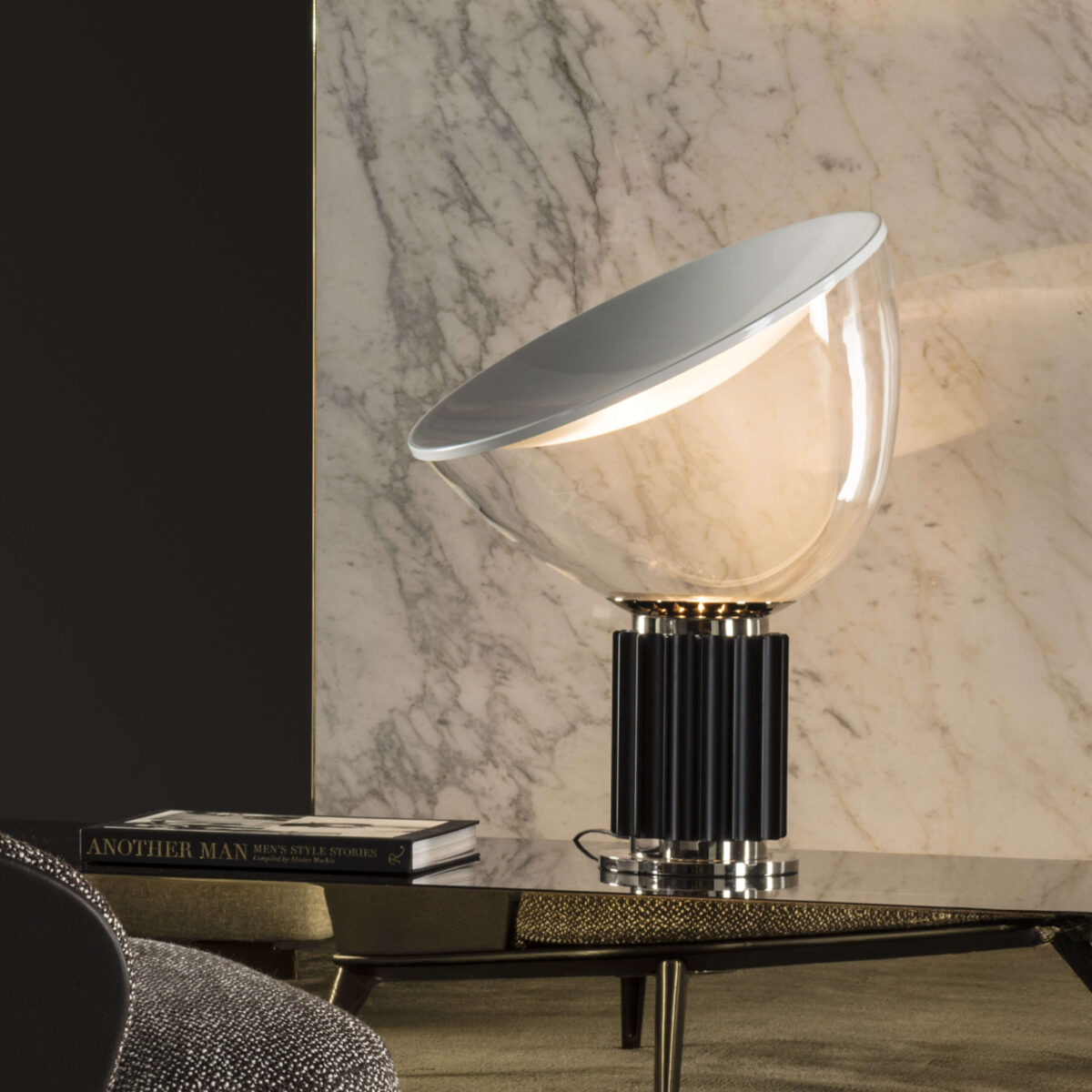 Taccia Table Lamp by Flos showcasing spun matte-white reflector and adjustable glass shade at the Michigan Design Center