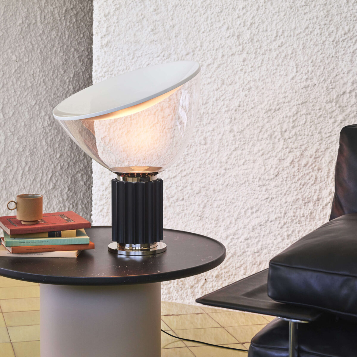 Taccia Small Lamp showcasing glossy white interior and matte exterior reflexive shade at the Michigan Design Center