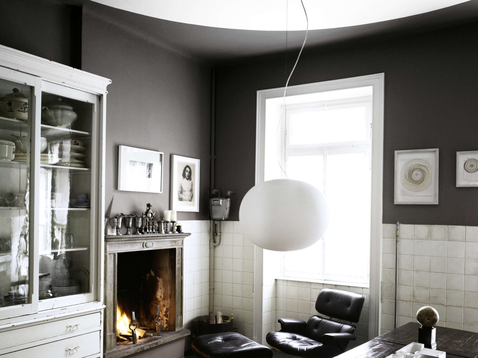 Two Glo‑Ball pendants—an S2 and a Mini S2—in a minimalist setting, the larger globe at 45 cm diameter, the smaller softly glowing beside it.