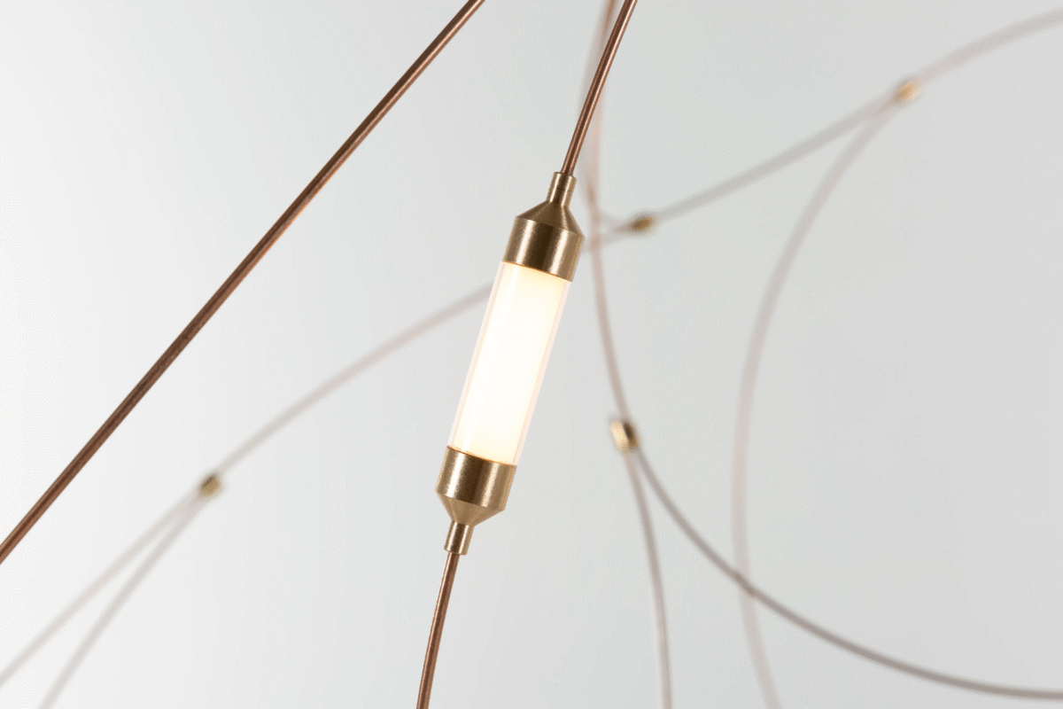 "Flock of Light pendant lamp in a contemporary living room setting, adding an artistic touch to the decor."