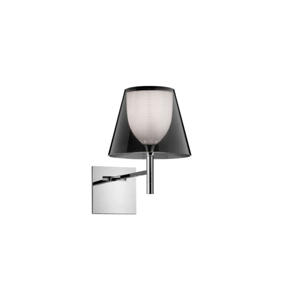 A modern Flos KTribe Wall lamp, featuring a cone-shaped outer shade in [specify material/color, e.g., "transparent PMMA" or "pleated fabric"], with a hidden inner diffuser, providing soft, diffused light.