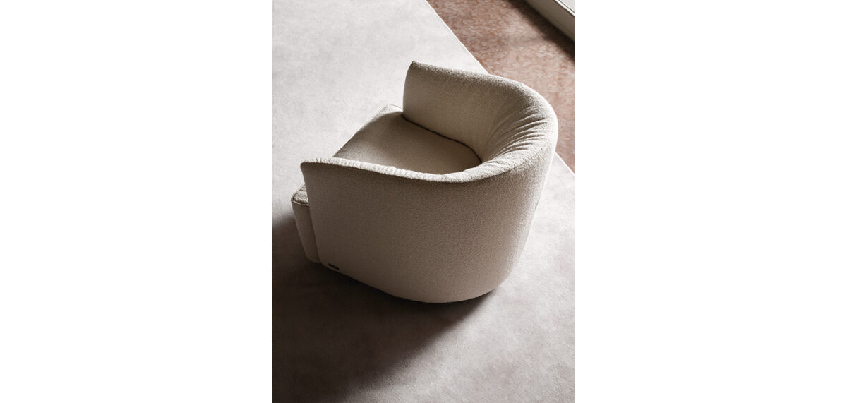 Lady Swivel armchair by Nicoline Italia with enveloping backrest and wooden swivel base, perfect for modern interiors in Royal Oak, Michigan.