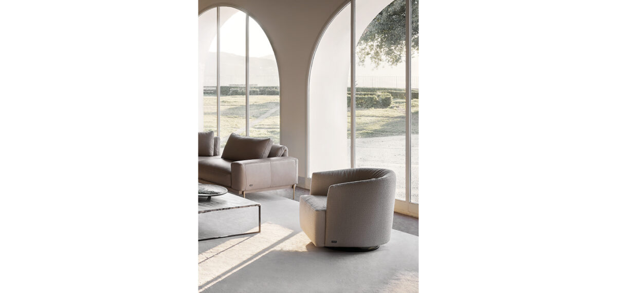 Lady Swivel armchair by Nicoline Italia with enveloping backrest and wooden swivel base, perfect for modern interiors in Royal Oak, Michigan.