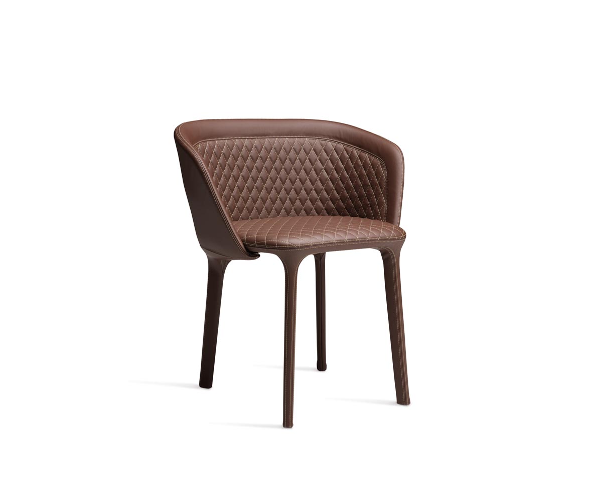 "Lepel Quilted Armchair by Casamania upholstered in soft grey fabric with diamond-pattern quilting and sleek metal legs."