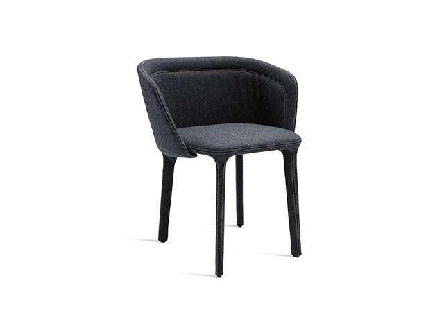 "Spoon Plain Armchair by Casamania in soft beige upholstery with smooth, rounded curves and wooden legs."