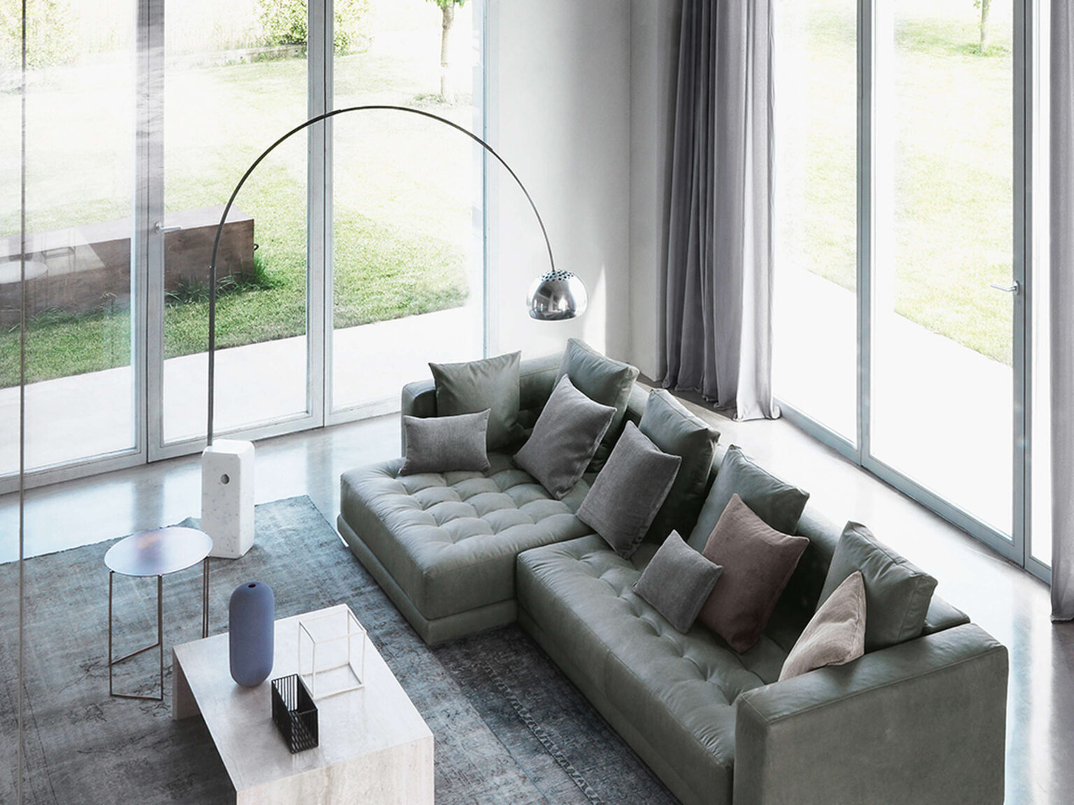 Arco LED floor lamp in modern living room setting, casting direct warm white light (2700 K) from its downlight dome.