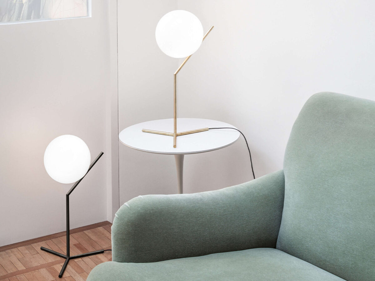 IC Lights T1 High Table Lamp by Flos side profile highlighting the glowing opal sphere and sleek black steel rod in a Troy Michigan setting