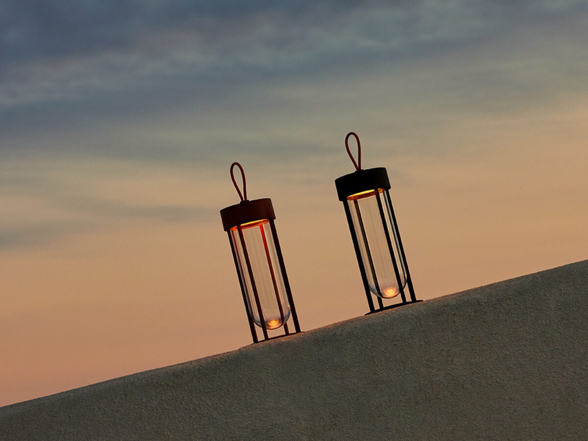 Side view of the In Vitro Unplugged portable lamp, showcasing its handle-free silhouette and contemporary finish.
