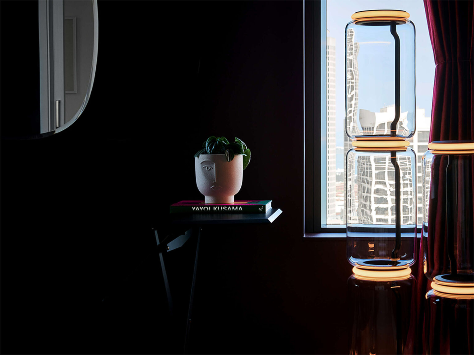 Detail shot of the glass‑on‑glass junctions with glowing silicone rings that evenly distribute LED light.