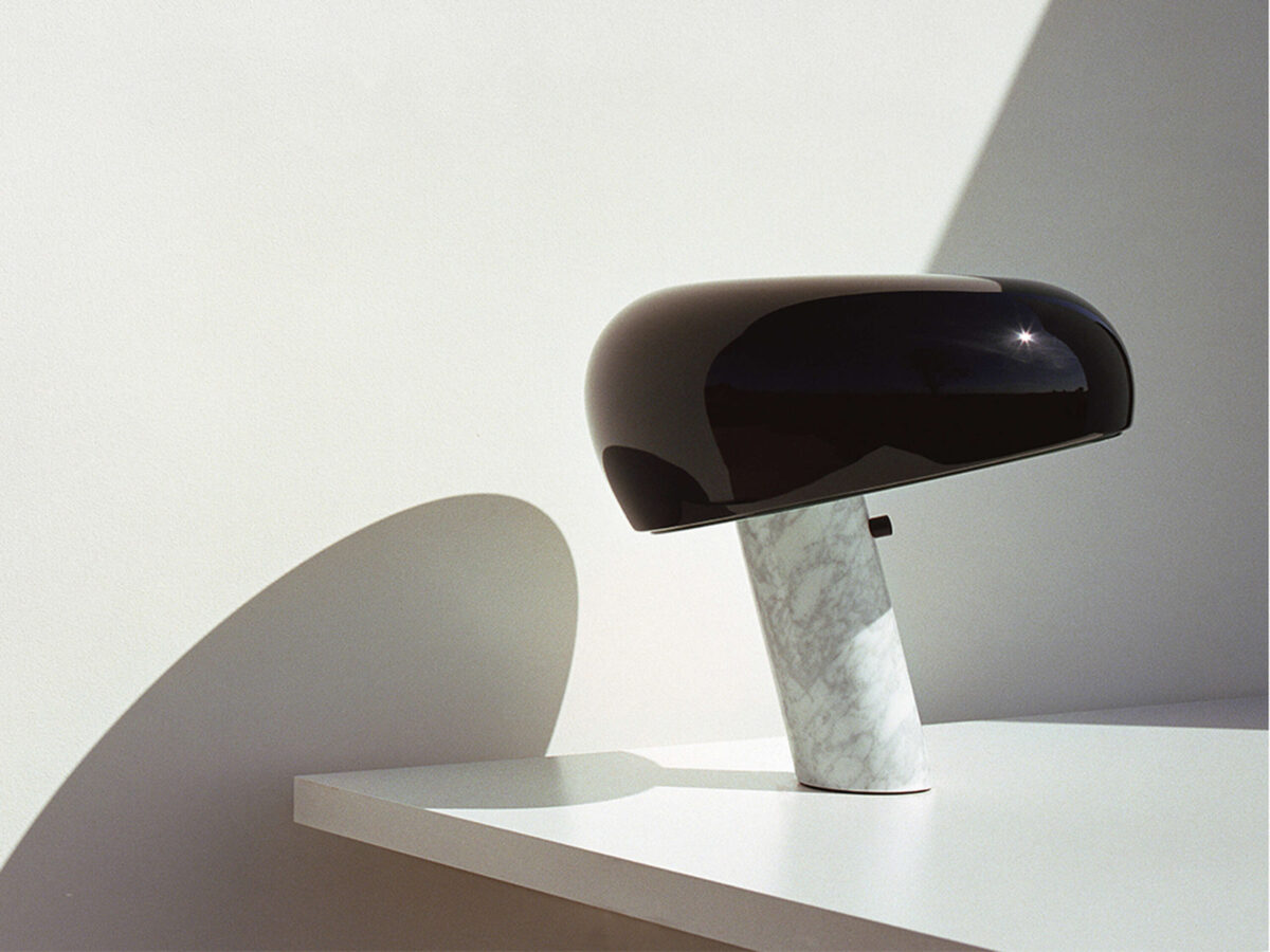 Snoopy Table Lamp by Flos rear view emphasizing balance between marble base and enameled shade in a Royal Oak Michigan interior