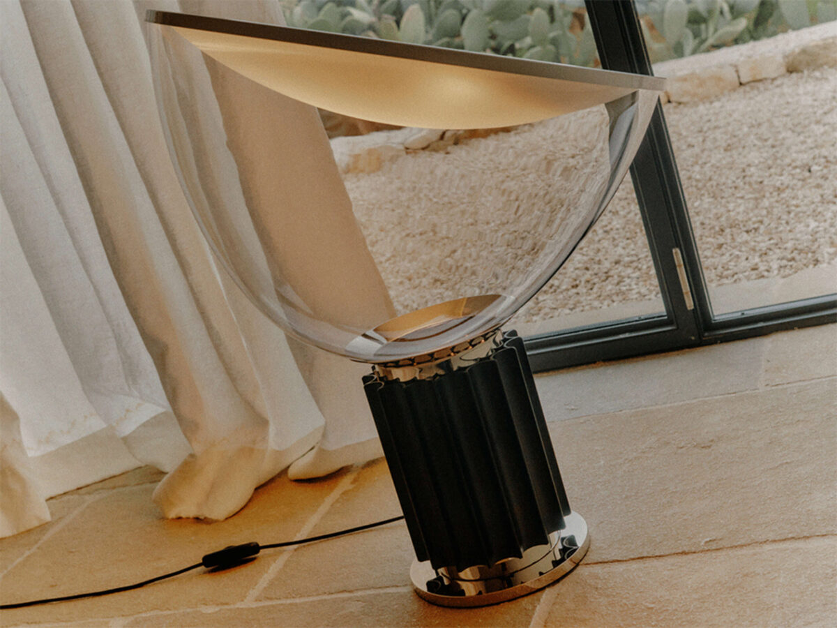 Taccia Table Lamp by Flos rear angle emphasizing sleek extruded-aluminum column base and cable with inline dimmer in a Royal Oak Michigan display